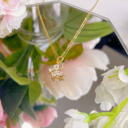Melange Blanc - N025 gold crystal butterfly charm pendant necklace